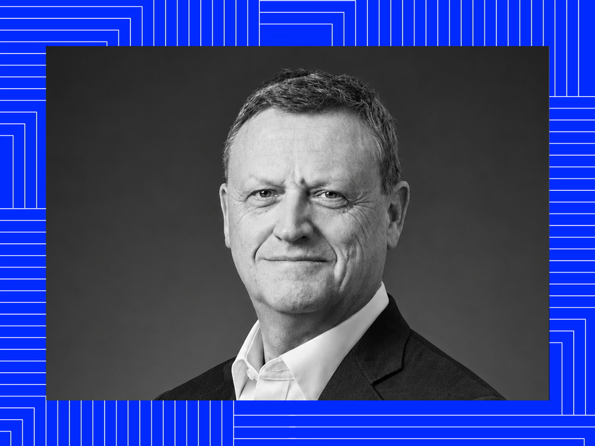 Black-and-white portrait of Chris over a blue patterned frame