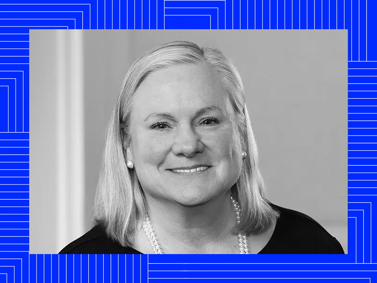 Black-and-white portrait of Trish over a blue patterned frame
